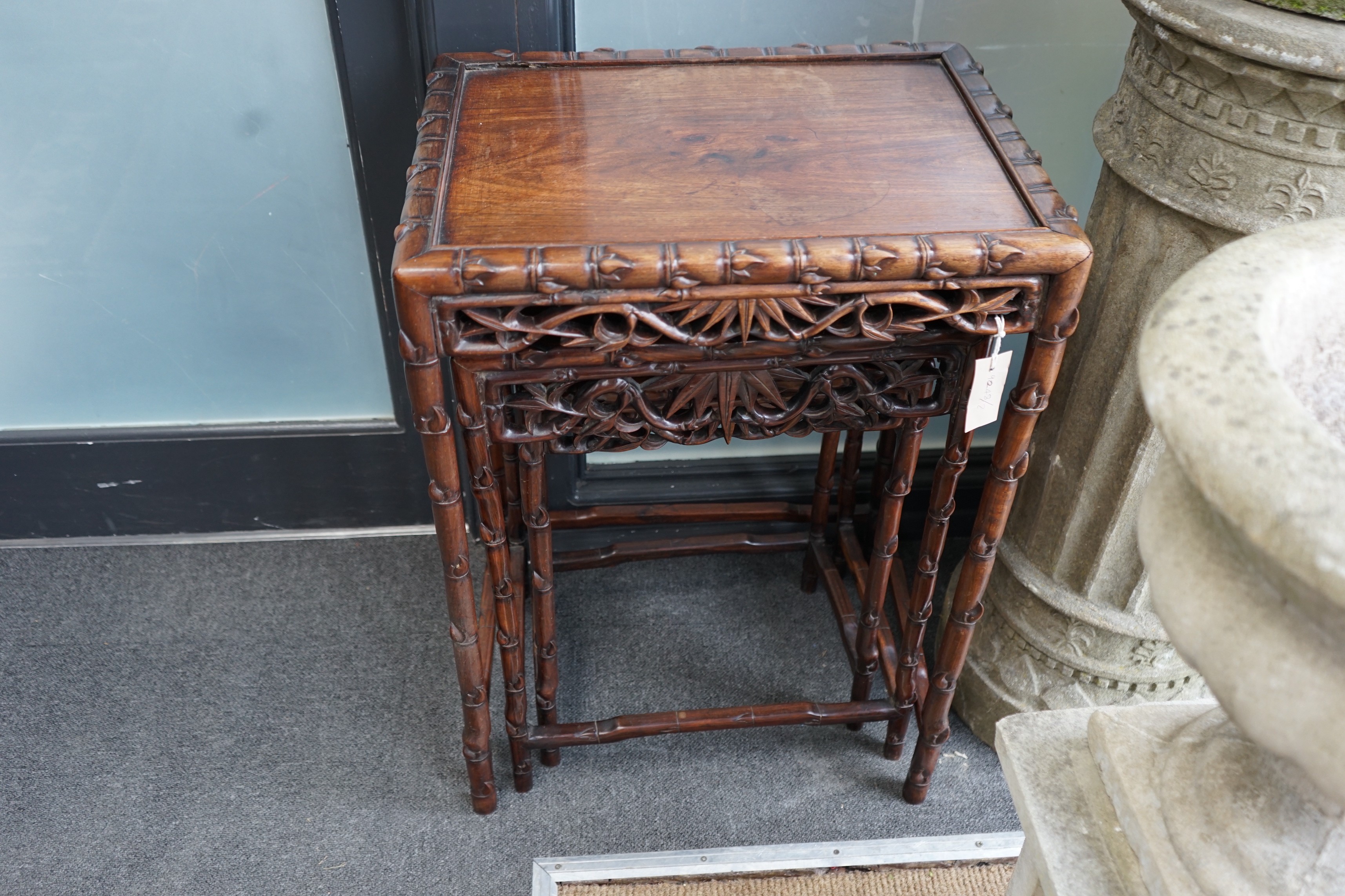 A nest of three Chinese hongmu rectangular tea tables, early 20th century, width 52cm, depth 39cm, height 74cm